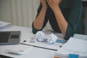 asian-women-sitting-in-a-home-office-with-stress-and-eye