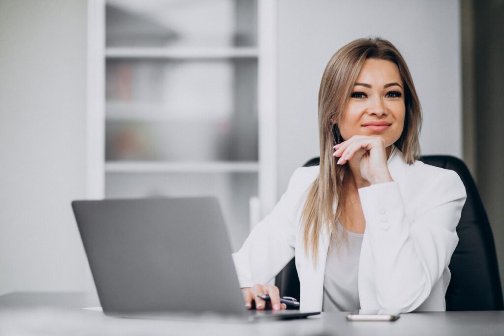 young-business-woman-working-laptop-office