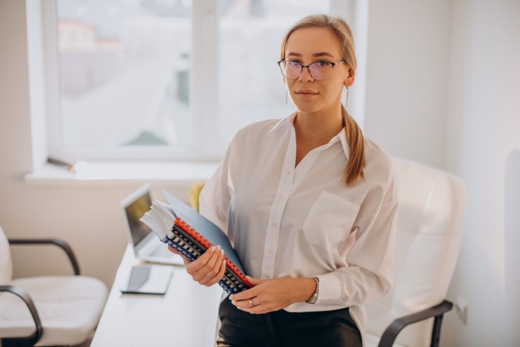 business-woman-holding-files-office